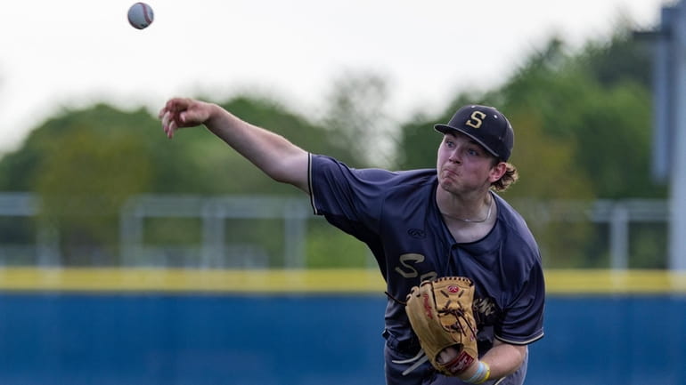 Ryan Palm #24 for Sachem North delivers a pitch during...