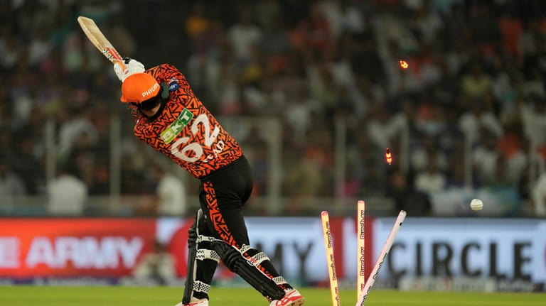 Sunrisers Hyderabad's Travis Head is bowled out by Kolkata Knight...