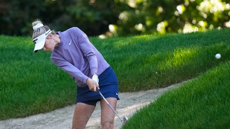 Nelly Korda hits from the bunker on the 16th hole...