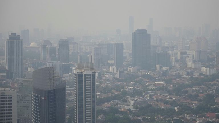 FILE- Haze blankets the main business district in Jakarta, Indonesia,...