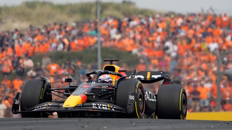 Red Bull driver Max Verstappen of the Netherlands steers his...