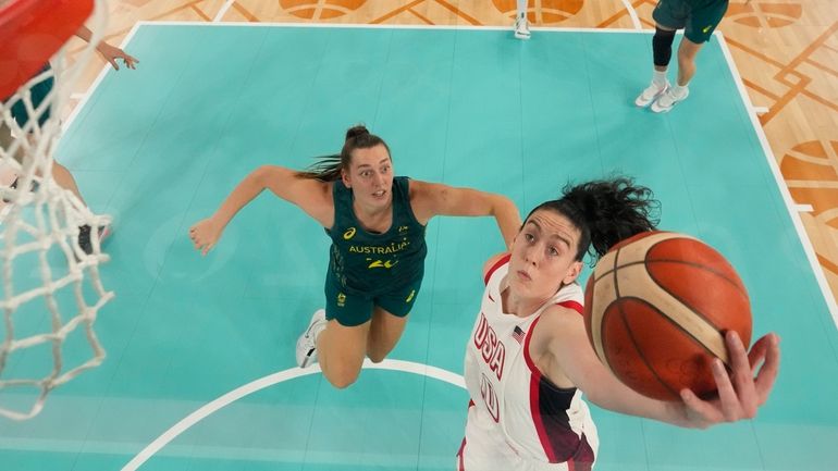 United States' Breanna Stewart (10) shoots past Isobel Borlase (20),...