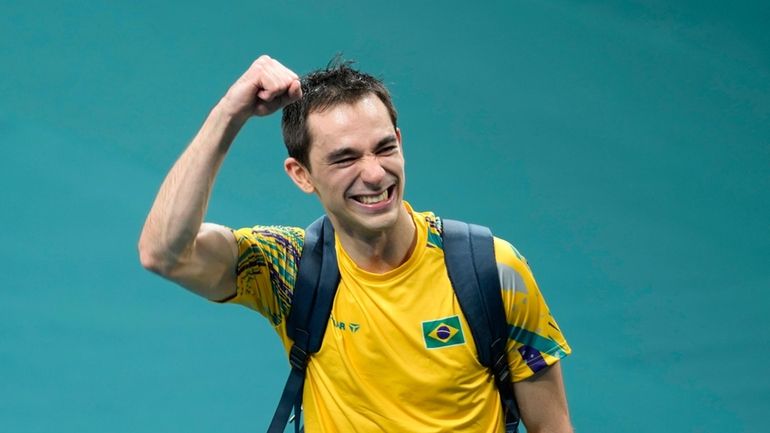 Brazil's Hugo Calderano reacts after his win against South Korea's...