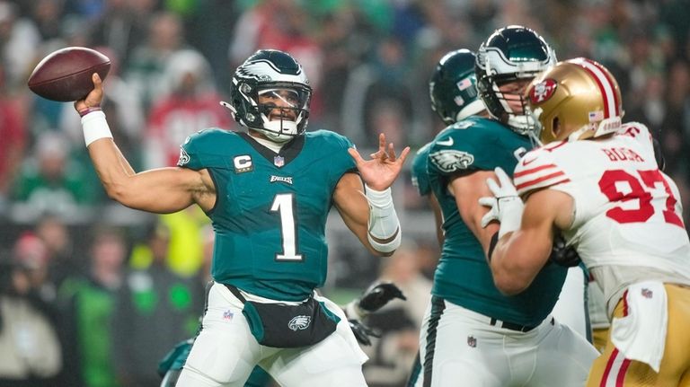 Philadelphia Eagles quarterback Jalen Hurts throws a pass against the...