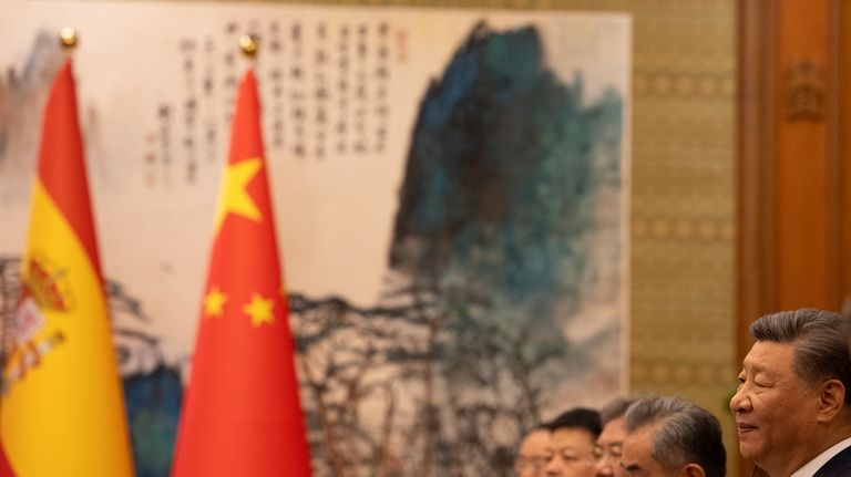 China's President Xi Jinping, right, attends his meeting with Spain's...