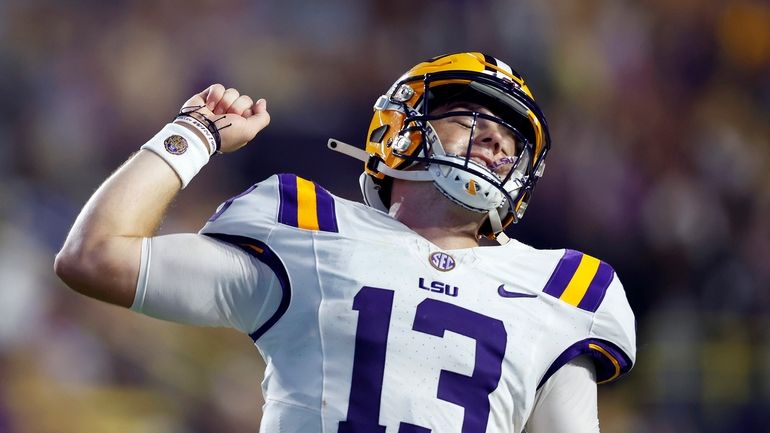 LSU quarterback Garrett Nussmeier (13) reacts after throwing a touchdown...