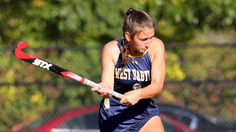 West Babylon forward Lacey Downey shoots and scores against Riverhead...