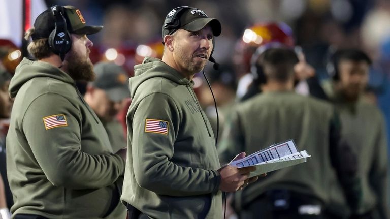 Iowa State coach Matt Campbell stands along the sideline during...