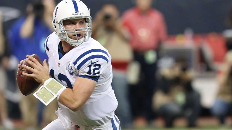 Indianapolis Colts quarterback Andrew Luck scrambles against the Houston Texans....