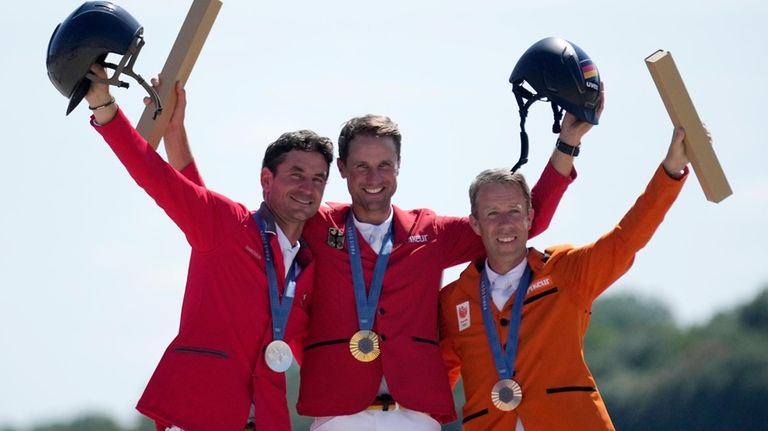 Netherlands' Maikel van der Vleuten, right, bronze medalist, Switzerland's Steve...