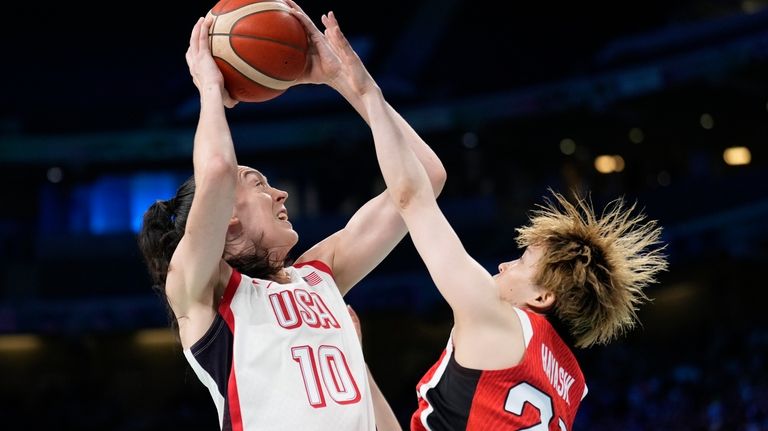 Breanna Stewart, of the Unites States, shoots over Saki Hayashi,...