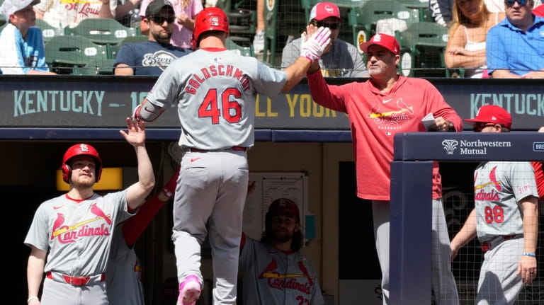St. Louis Cardinals' Paul Goldschmidt is congratulated after hitting a...