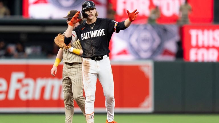 Baltimore Orioles' Gunnar Henderson reacts after hitting a double during...