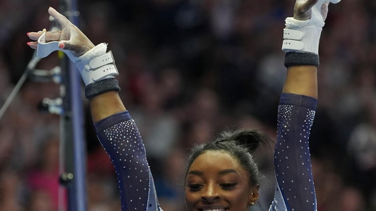 Simone Biles lands after the uneven bars at the United...