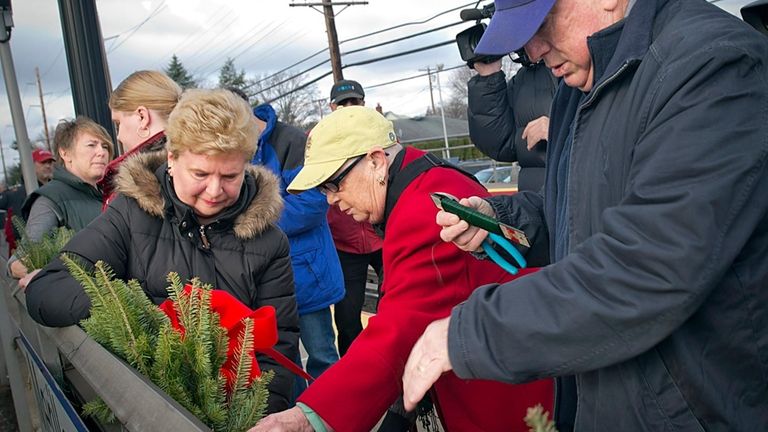 Joyce Gorycki, left, then-Congresswoman Carolyn McCarthy and family members of...