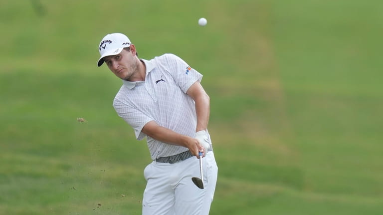 Emiliano Grillo, of Argentina, hits an approach shot on the...