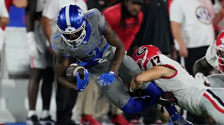 Kentucky wide receiver Barion Brown (7) is tackled by Georgia...