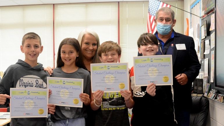 From left, students Sean D'Onofrio, Gabriella Arnemann, Zachary Abend and...