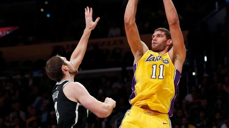 Lakers center Brook Lopez shoots over Nets center Tyler Zeller...