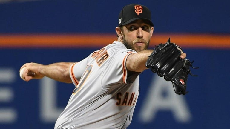 San Francisco Giants' Madison Bumgarner delivers a pitch in first...