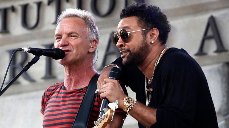 Sting, left, and Shaggy perform before Game 3 of the...