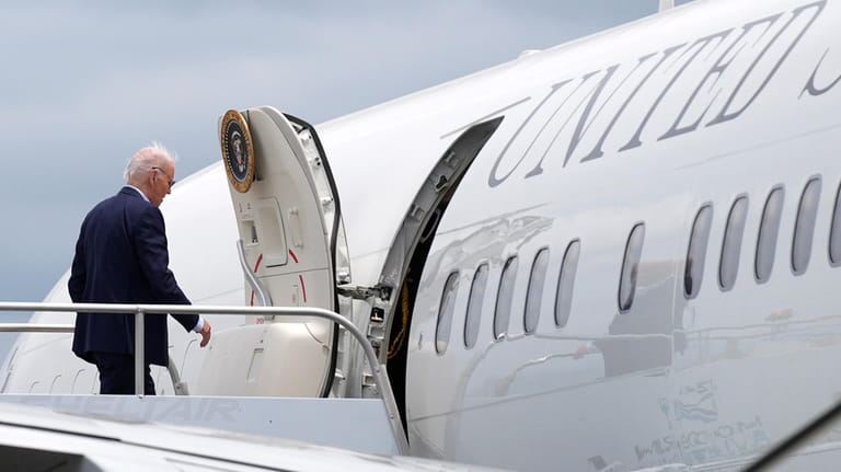 President Joe Biden boards Air Force One at LaGuardia International...