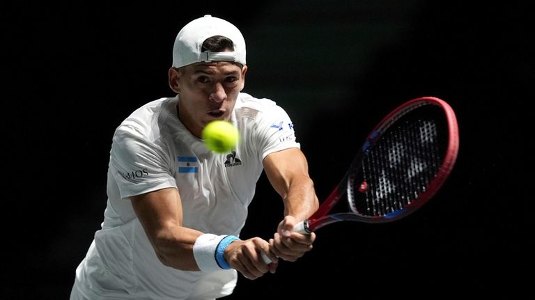 Argentina's Sebastian Baez in action against Canada's Felix Auger Aliassime,...