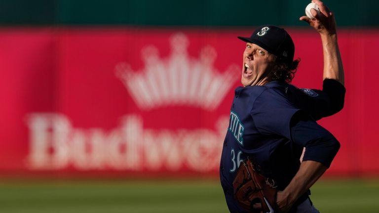 Seattle Mariners' Logan Gilbert pitches to an Oakland Athletics batter...