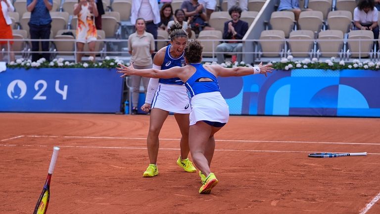 Sara Errani and Jasmine Paolini of Italy celebrate after they...