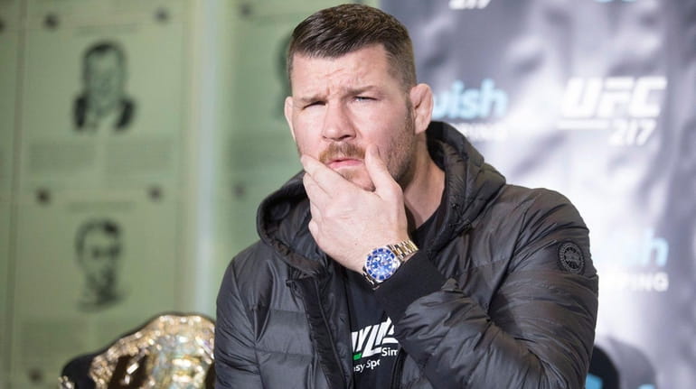 Michael Bisping gestures during a news conference in Toronto on...
