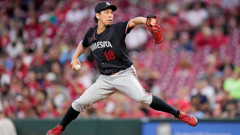 Minnesota Twins starting pitcher Kenta Maeda throws to a Cincinnati...