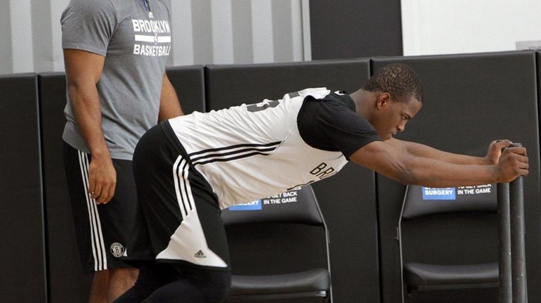 Brooklyn Nets' Isaiah Whitehead completes an exercise routine during the...