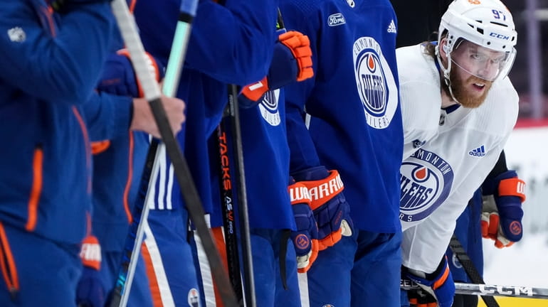 Edmonton Oilers forward Connor McDavid watches a drill during practice...