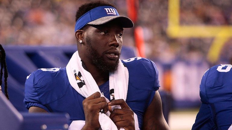 Jason Pierre-Paul of the Giants looks on from the sidelines...