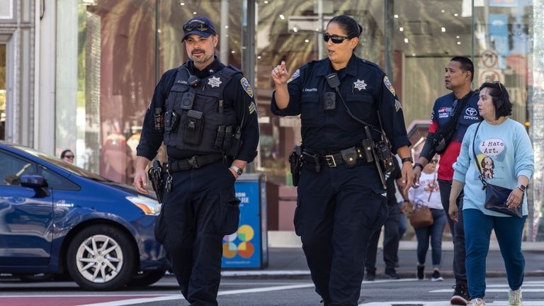 Officers with the San Francisco Police Department patrol in Union...