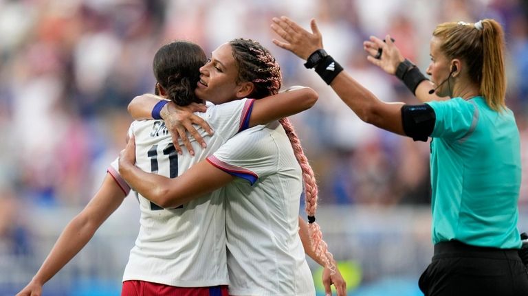 United States' Sophia Smith celebrates with Trinity Rodman the opening...