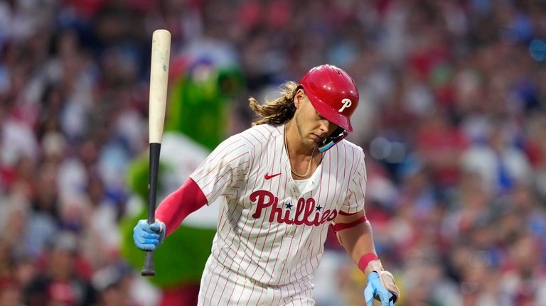 Philadelphia Phillies' Alec Bohm reacts after flying out against Houston...