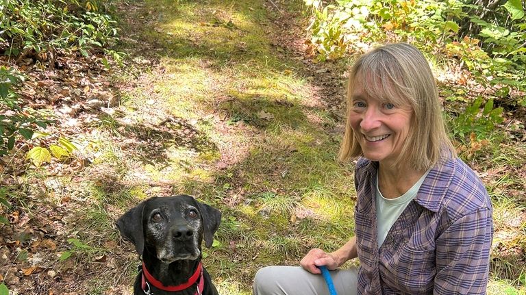 Susannah Johnston, of Croton-on-Hudson, N.Y., poses her dog on Sept....