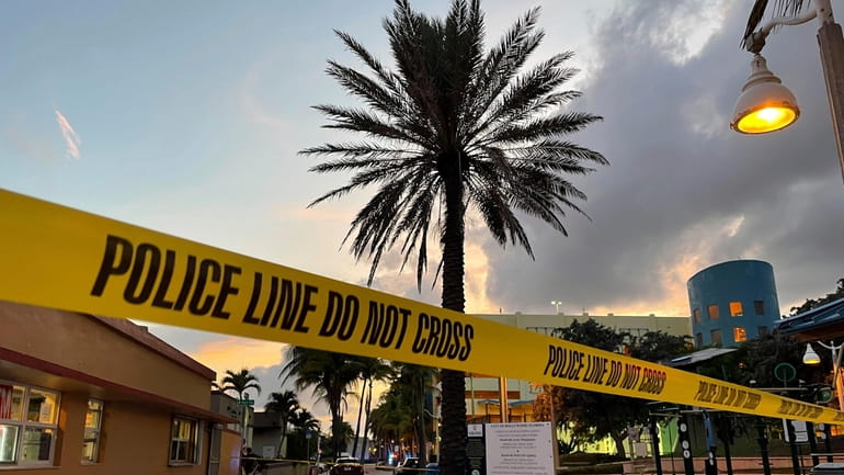 Police cordon off an area as they respond to a...