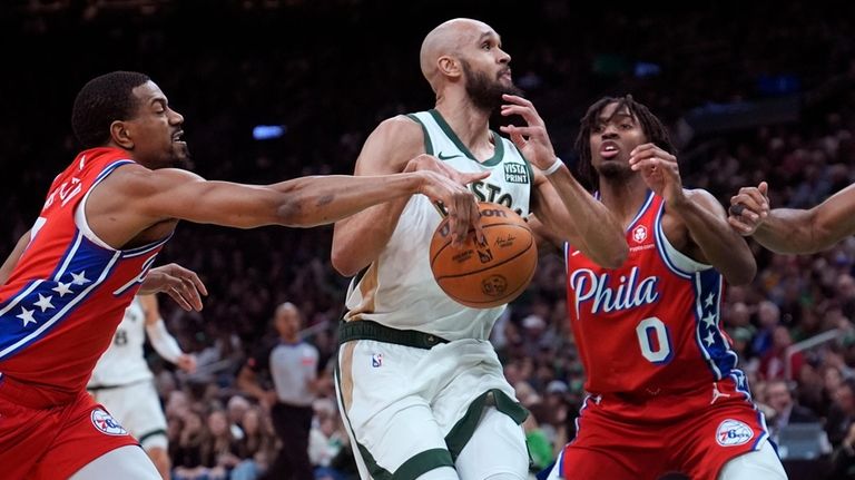 Philadelphia 76ers guard De'Anthony Melton, left, strips the ball from...