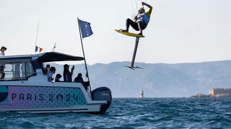 Colombia's Victor Alfonso Bolanos Lopez flies in the air lifted...