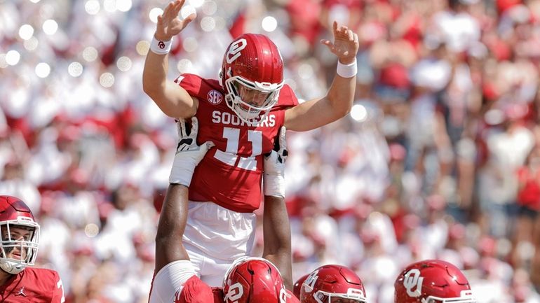 Oklahoma quarterback Jackson Arnold (11) celebrates after scoring a touchdown...