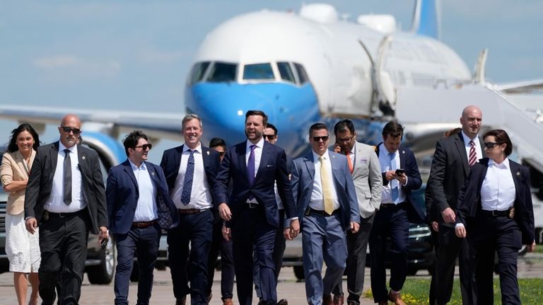 Republican vice presidential nominee Sen. JD Vance, R-Ohio, walks back...