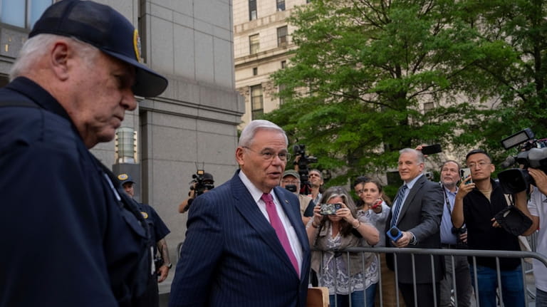 Sen. Bob Menendez, D-N.J., front right, leaves Manhattan federal court,...