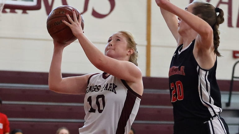 Kings Park guard Jaxie Cestone drives the paint with the...