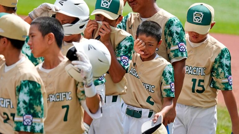 The Taiwan Little League team lines up for the handshake...