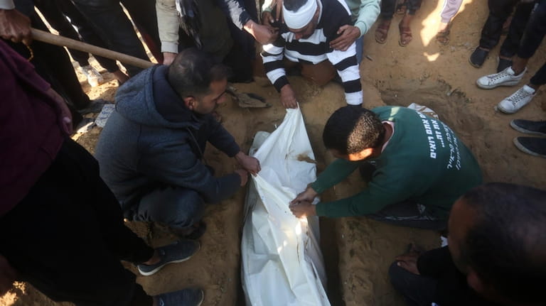 Palestinians bury a four-year-old Abdul Rahman Muamm, killed in the...