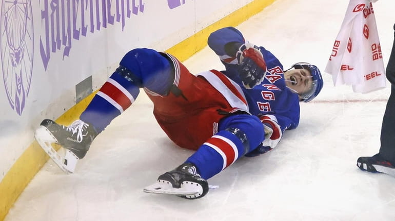 Kaapo Kakko of the Rangers is injured during the second...