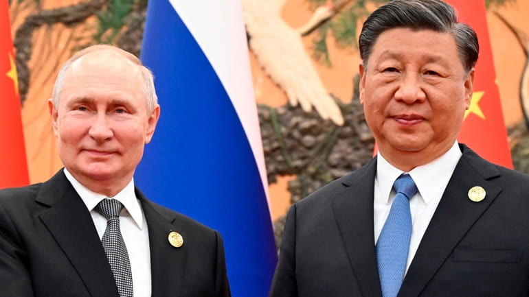 Chinese President Xi Jinping, right, and Russian President Vladimir Putin...