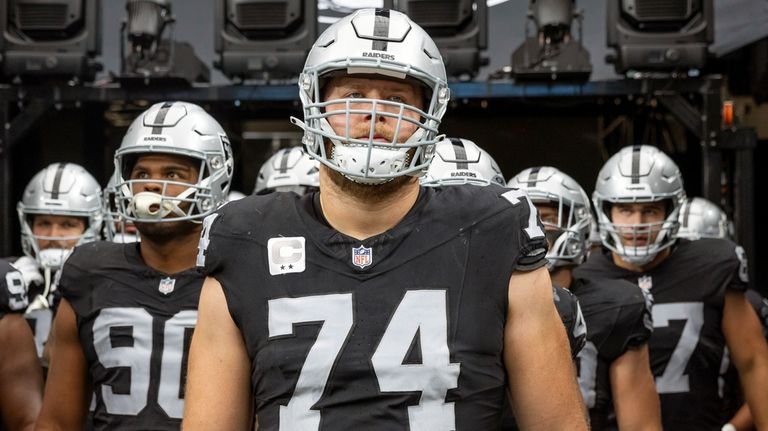 Las Vegas Raiders tackle Kolton Miller (74) enters the field...